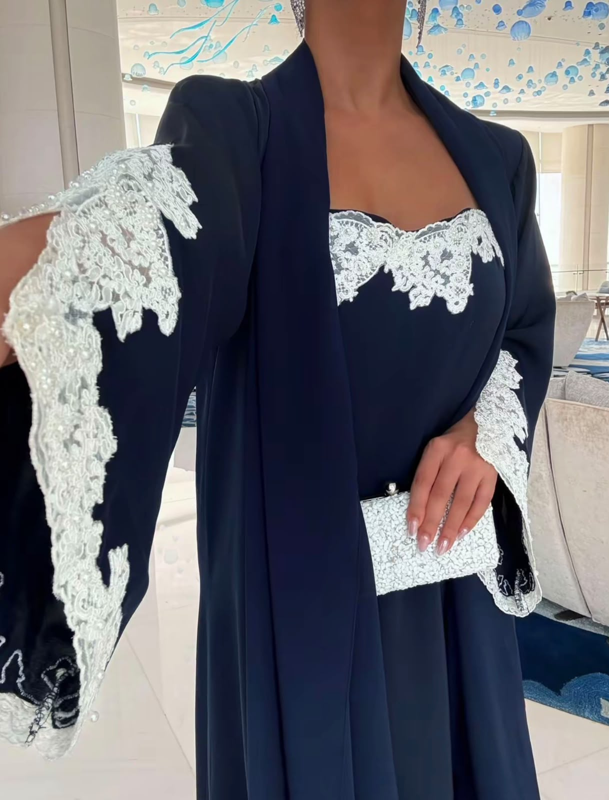 Ivory lace and midnight blue fabric detail from Hiba Altawil